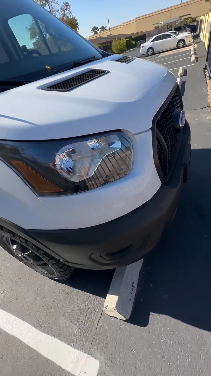 My Transit before coating, with a white hood and dark plastic front bumper.