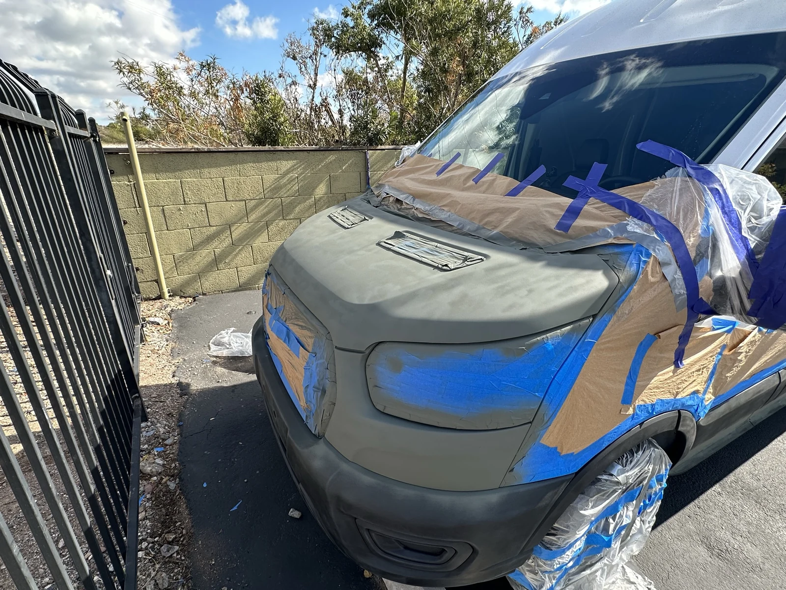 Gray-green primed hood on my masked Ford Transit.