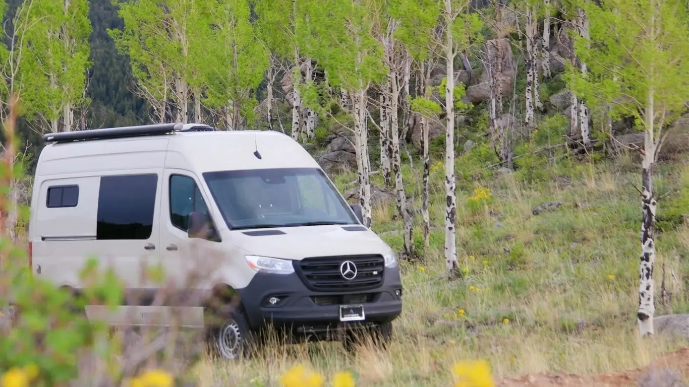 Mercedes-Benz Sprinter conversion pictured by The Vansmith among trees.