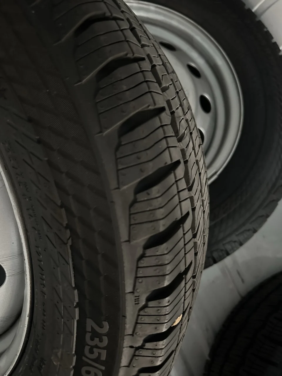 Additional original photograph of the stock tire shoulder and tread pattern.