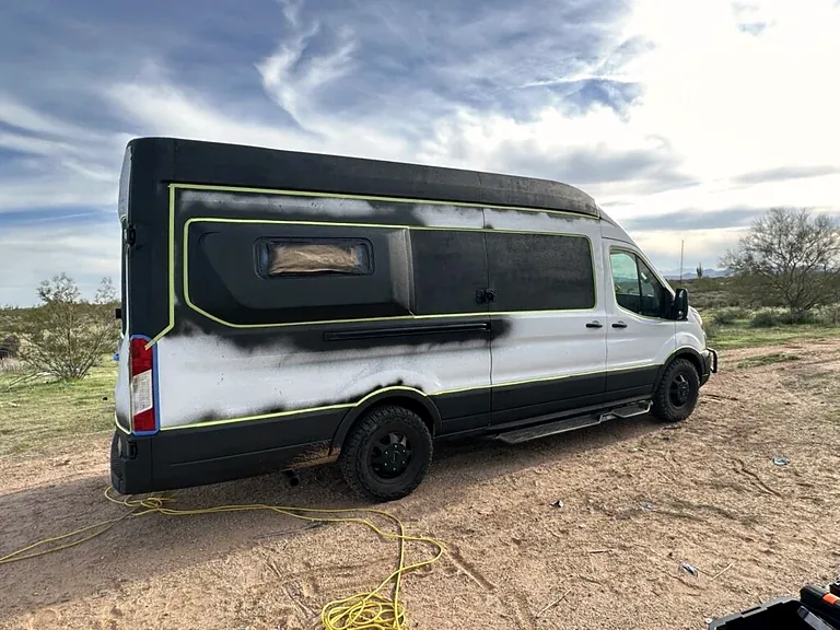 My Ford Transit in daylight during preparation for its white exterior bedliner coating