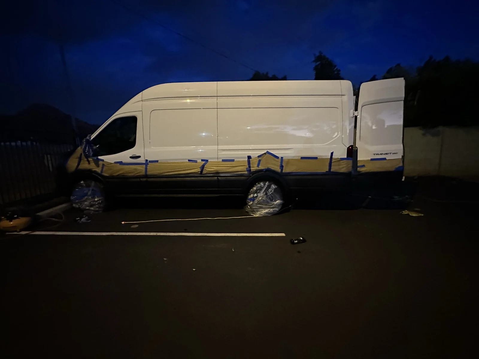 The lower sides after spraying, with masking and wheel covers still in place.