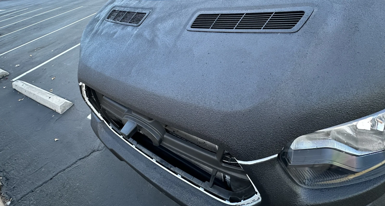 The hood and vent inserts with the front grille removed.