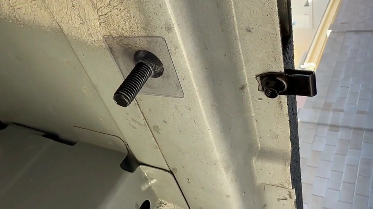 An inserted threaded fastener and a clipped mounting point beneath the passenger side of my Transit.