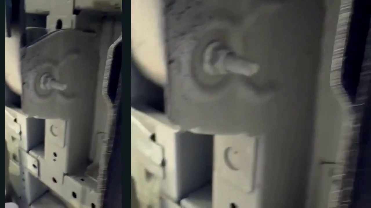 A close view of the lower-trim retainer and surrounding underside, shown in the completed landscape film.