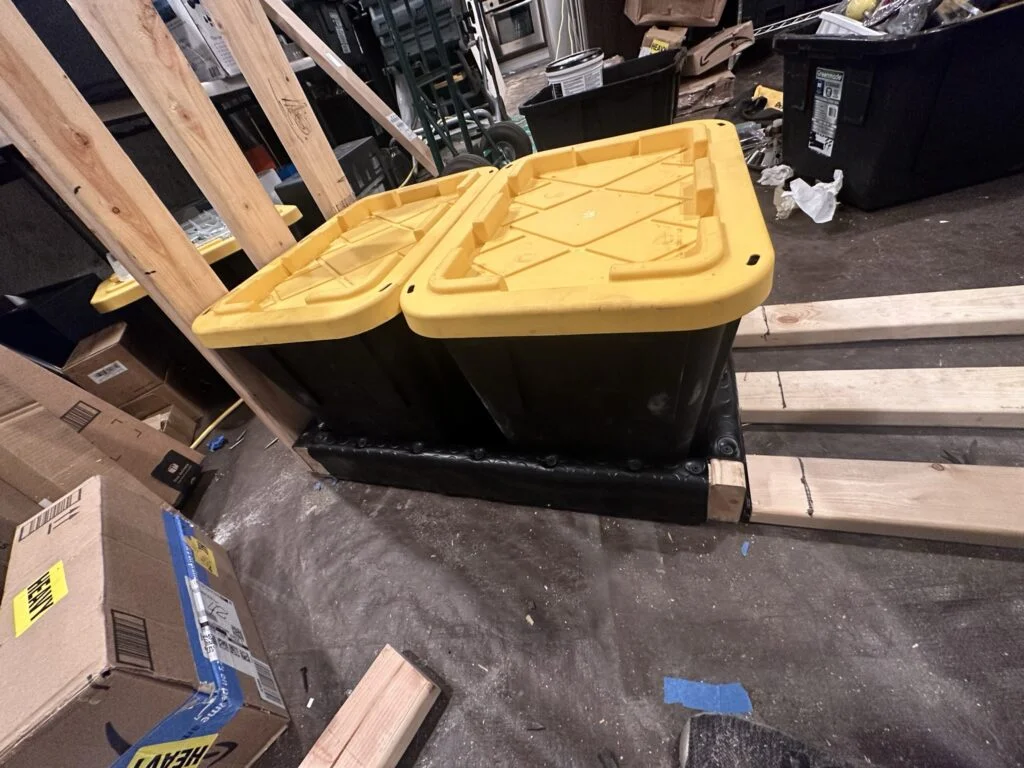 The containers positioned in the drawer during the storage-system work.