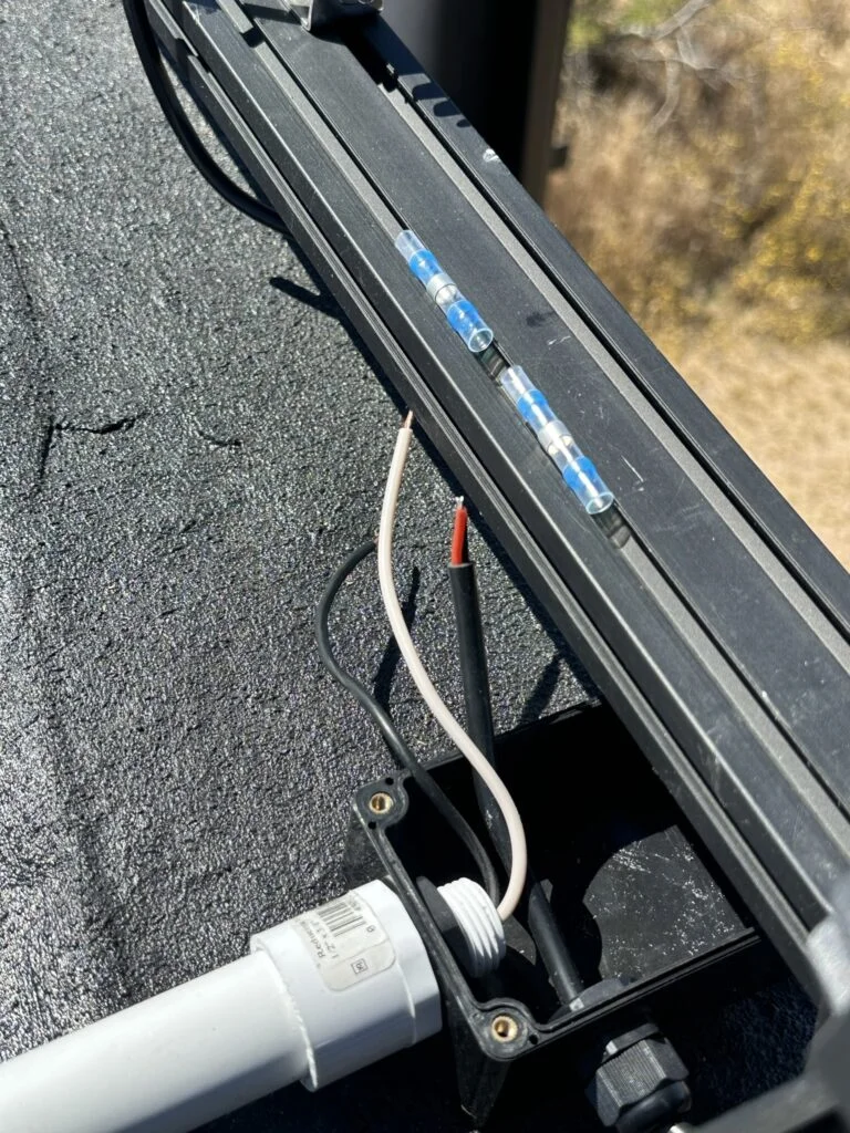 The nearby conduit and wire-connection area during that stage.