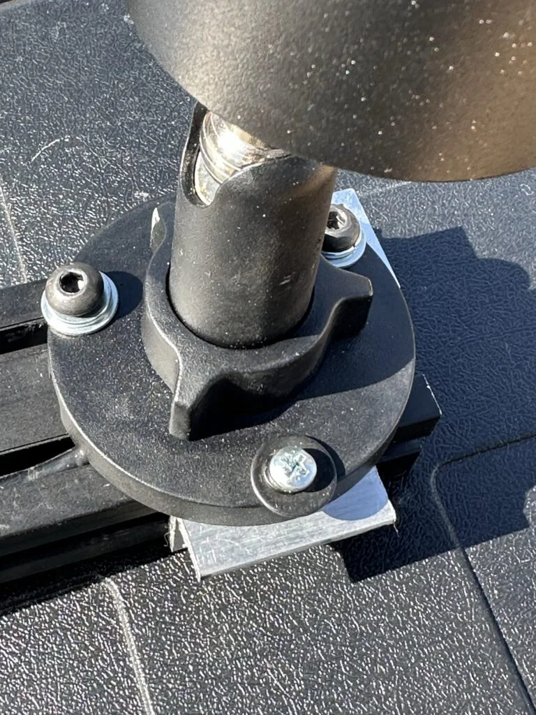Small drilled bracket pieces around a camera mounting point.