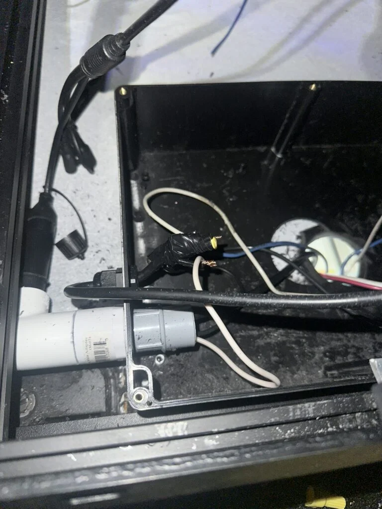 Electrical tape around a group of light-wire connections in my roof-wiring work.