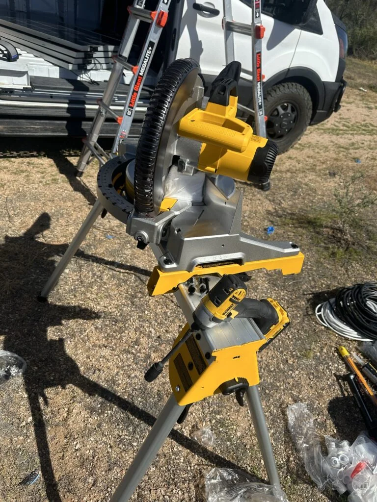 My miter saw attached to its portable stand during the roof-mount work.