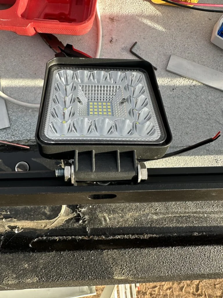 A small LED pod on my custom mounting plates beside the rack.