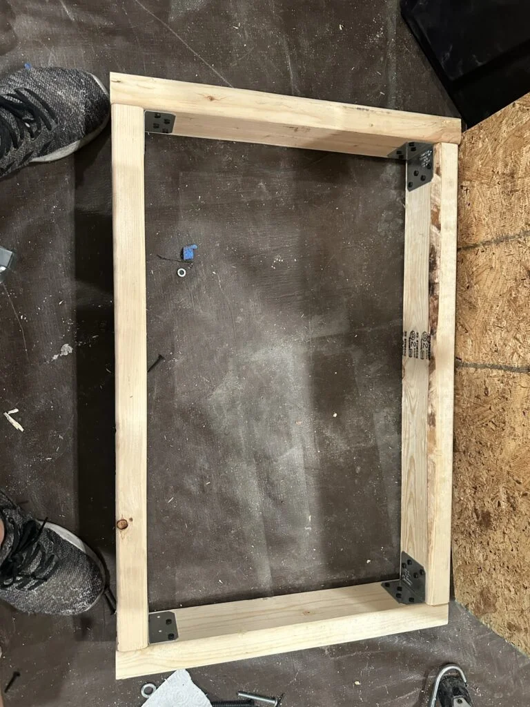 The timber drawer frame during construction on the patio.